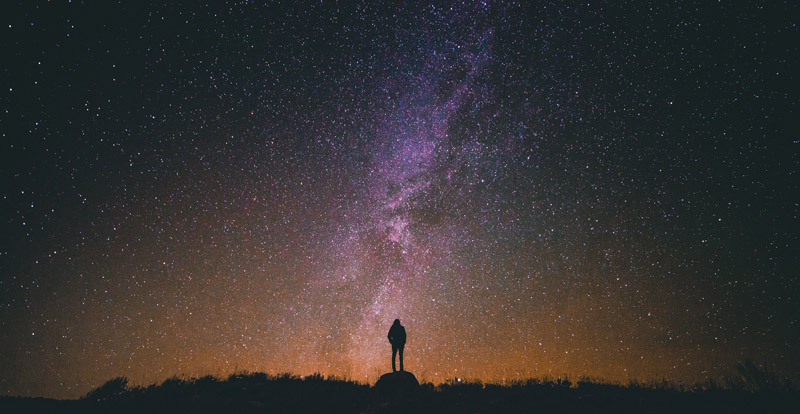 person staring at stars