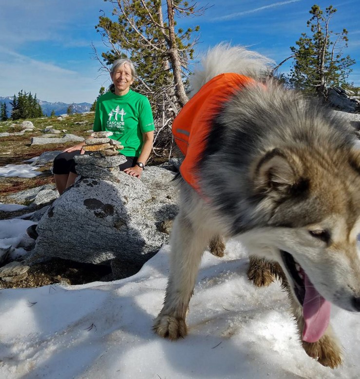 writer and dog on mountain