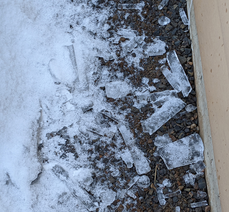 broken icicles next to house