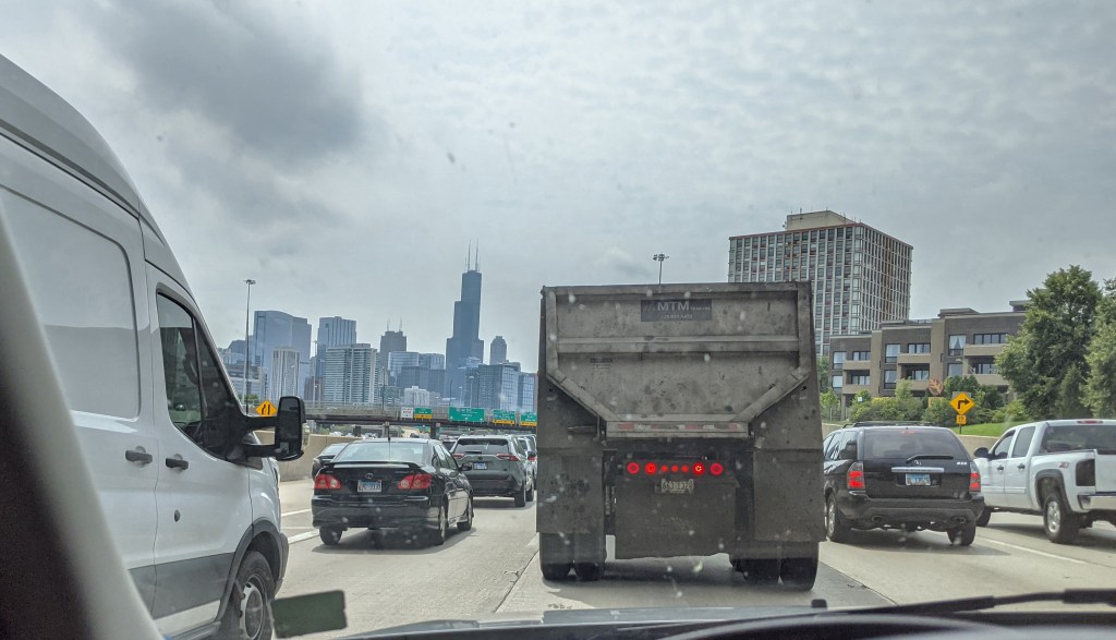 Four lanes of traffic through downtown Chicago on a Saturday morning.