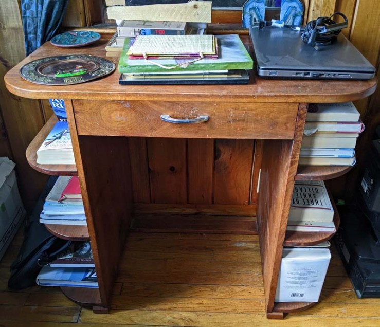 desk made from black walnut with books on side shelves
