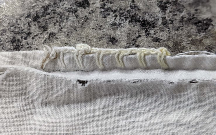 A few of the blanket stitches that remain on Grandma's dish cloth.